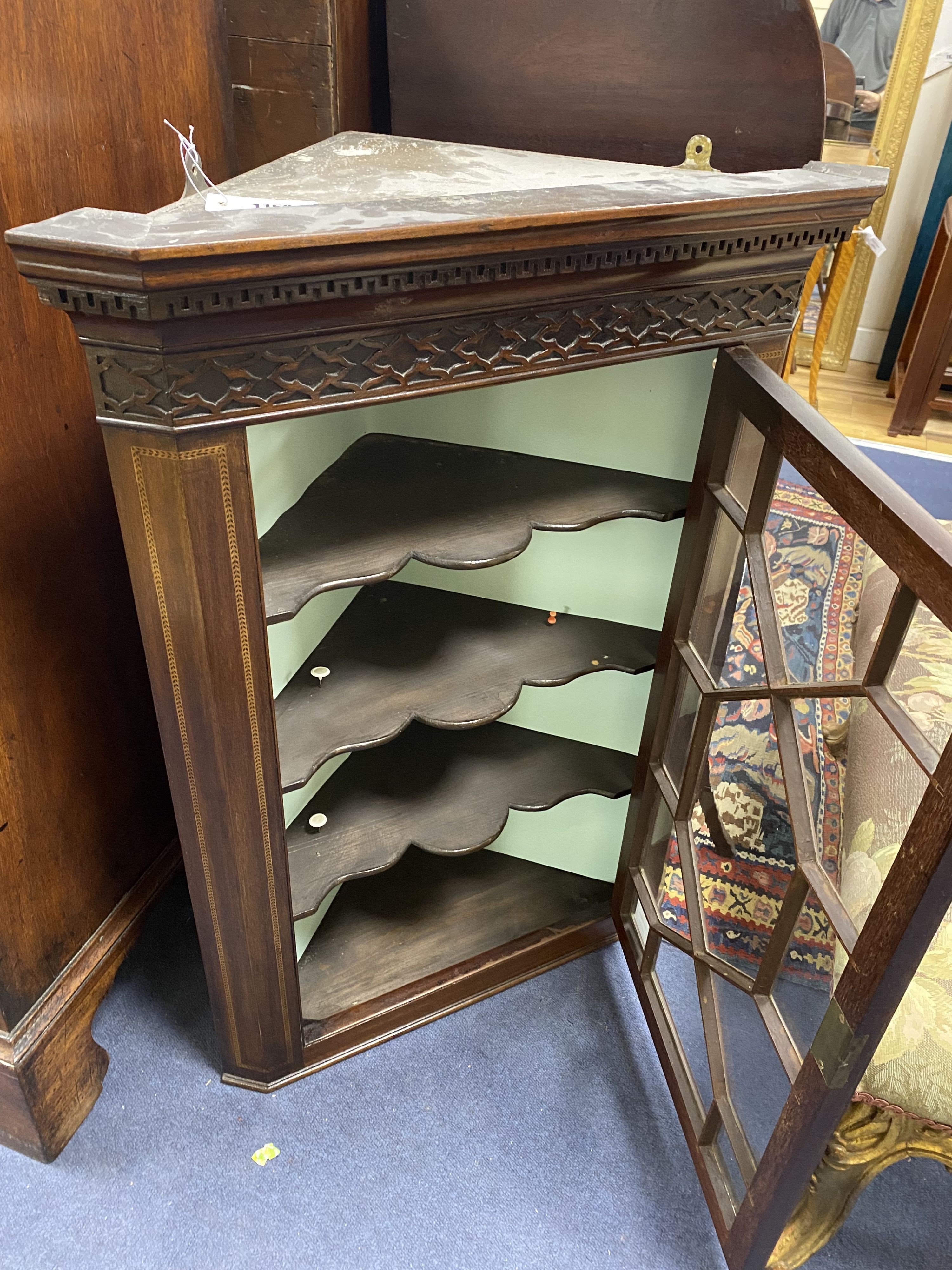 A George III style mahogany hanging corner cupboard, width 62cm, depth 35cm, height 87cm